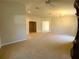 Spacious living room with carpet and neutral walls at 5598 Sw 39Th St, Ocala, FL 34474