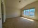 Bright bedroom with carpet flooring and large windows at 5598 Sw 39Th St, Ocala, FL 34474