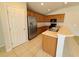 Kitchen with wood cabinets, stainless steel appliances, and an island at 5598 Sw 39Th St, Ocala, FL 34474