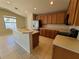 Kitchen features wood cabinets and an island at 5598 Sw 39Th St, Ocala, FL 34474