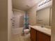 Clean bathroom with tub, shower, and wood vanity at 5598 Sw 39Th St, Ocala, FL 34474