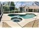Enjoy this large, screened pool with a built-in spa at 9029 Laurel Ridge Dr, Mount Dora, FL 32757