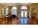 Formal dining room with hardwood floors and entryway view at 9029 Laurel Ridge Dr, Mount Dora, FL 32757