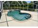 Relaxing screened pool with a spa and tanning ledge at 9029 Laurel Ridge Dr, Mount Dora, FL 32757
