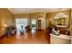 Spacious living area with hardwood floors and arched entryways at 9029 Laurel Ridge Dr, Mount Dora, FL 32757