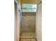 Modern shower with glass enclosure and tile surround at 9029 Laurel Ridge Dr, Mount Dora, FL 32757