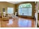 Spacious living room with hardwood floors and large window at 9029 Laurel Ridge Dr, Mount Dora, FL 32757