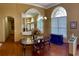 Formal dining room with hardwood floors and a large mirror at 9029 Laurel Ridge Dr, Mount Dora, FL 32757
