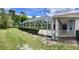 Landscaped backyard with a large, screened pool and patio area at 9029 Laurel Ridge Dr, Mount Dora, FL 32757