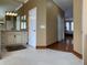 Large bathroom with double sinks, a walk-in shower, and access to other rooms at 9029 Laurel Ridge Dr, Mount Dora, FL 32757