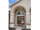 Double doors with arched entry and brick walkway at 9029 Laurel Ridge Dr, Mount Dora, FL 32757
