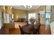 Dining room with hardwood floors and view of living room at 9029 Laurel Ridge Dr, Mount Dora, FL 32757