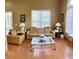 Living area with hardwood floors and leather furniture at 9029 Laurel Ridge Dr, Mount Dora, FL 32757