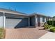 Gray house exterior with gray garage door and brick pavers at 5237 Nw 34Th St, Ocala, FL 34482
