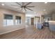 Living area with hardwood floors and open concept to kitchen at 5237 Nw 34Th St, Ocala, FL 34482