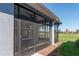 Screened porch overlooking a lush green golf course at 5237 Nw 34Th St, Ocala, FL 34482