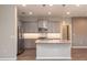 Modern kitchen with gray cabinets, granite island, and stainless steel appliances at 5237 Nw 34Th St, Ocala, FL 34482