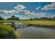 Scenic golf course with pond and wooden footbridge at 5237 Nw 34Th St, Ocala, FL 34482
