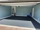 Garage with epoxy flooring, water heater, and storage space at 5237 Nw 34Th St, Ocala, FL 34482