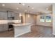 Modern kitchen with gray cabinets, granite island, and stainless steel appliances at 5237 Nw 34Th St, Ocala, FL 34482