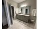 Double vanity bathroom with granite countertop and a large walk-in shower at 5237 Nw 34Th St, Ocala, FL 34482