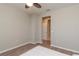 Simple bedroom with light walls, wood-look floors and a window with blinds at 5237 Nw 34Th St, Ocala, FL 34482