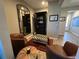 Cozy lounge area with leather chairs, ottoman, and stylish mirror at 5237 Nw 34Th St, Ocala, FL 34482