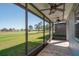 Screened porch with golf course view and ceiling fans at 5237 Nw 34Th St, Ocala, FL 34482
