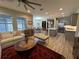 Open living room with kitchen views and a ceiling fan at 5237 Nw 34Th St, Ocala, FL 34482