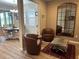 Cozy sitting area with leather chairs and zebra print ottoman at 5237 Nw 34Th St, Ocala, FL 34482