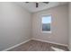 Simple bedroom with wood-look floors, a window, and neutral-colored walls at 5237 Nw 34Th St, Ocala, FL 34482