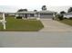 Single-story home with attached garage and driveway at 9951 Sw 62Nd Ter, Ocala, FL 34476