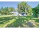 Ranch-style home with covered patio and fenced yard at 2429 Cr 451, Lake Panasoffkee, FL 33538