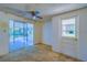 Empty Gathering room with sliding glass doors leading to a screened patio at 2429 Cr 451, Lake Panasoffkee, FL 33538