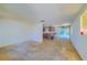 Large living room with worn carpet at 2429 Cr 451, Lake Panasoffkee, FL 33538