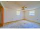 Empty bedroom with ceiling fan and carpeted floor at 2429 Cr 451, Lake Panasoffkee, FL 33538