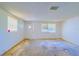 Empty living room with worn carpet at 2429 Cr 451, Lake Panasoffkee, FL 33538