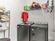 Laundry room with washer, dryer, shelving, and ample storage space at 6839 Sw 149Th Lane Rd, Ocala, FL 34473