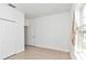 Spacious bedroom with tile floors and double doors at 6839 Sw 149Th Lane Rd, Ocala, FL 34473