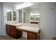 Double vanity bathroom with a large mirror at 5038 Se 6Th Ave, Ocala, FL 34480