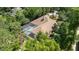 Aerial view of house with pool and lush landscaping at 5038 Se 6Th Ave, Ocala, FL 34480