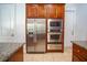 Stainless steel appliances in kitchen with wood cabinets and granite counters at 5038 Se 6Th Ave, Ocala, FL 34480