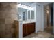 Bathroom with double vanity and wood cabinets at 5038 Se 6Th Ave, Ocala, FL 34480