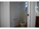Small half bathroom with toilet and single sink at 5038 Se 6Th Ave, Ocala, FL 34480