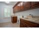 Bright laundry room with ample cabinetry and a convenient sink at 5038 Se 6Th Ave, Ocala, FL 34480