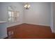 Bright dining room with hardwood floors and a chandelier at 5038 Se 6Th Ave, Ocala, FL 34480