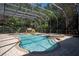 Inviting screened pool and spa with waterfall feature at 5038 Se 6Th Ave, Ocala, FL 34480