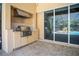 Outdoor kitchen with stainless steel appliances and adjacent patio at 5038 Se 6Th Ave, Ocala, FL 34480