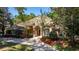 Stunning one-story home with stone accents and a manicured lawn at 5038 Se 6Th Ave, Ocala, FL 34480