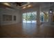 Bright Gathering room showcasing a view of the pool through sliding glass doors at 5038 Se 6Th Ave, Ocala, FL 34480